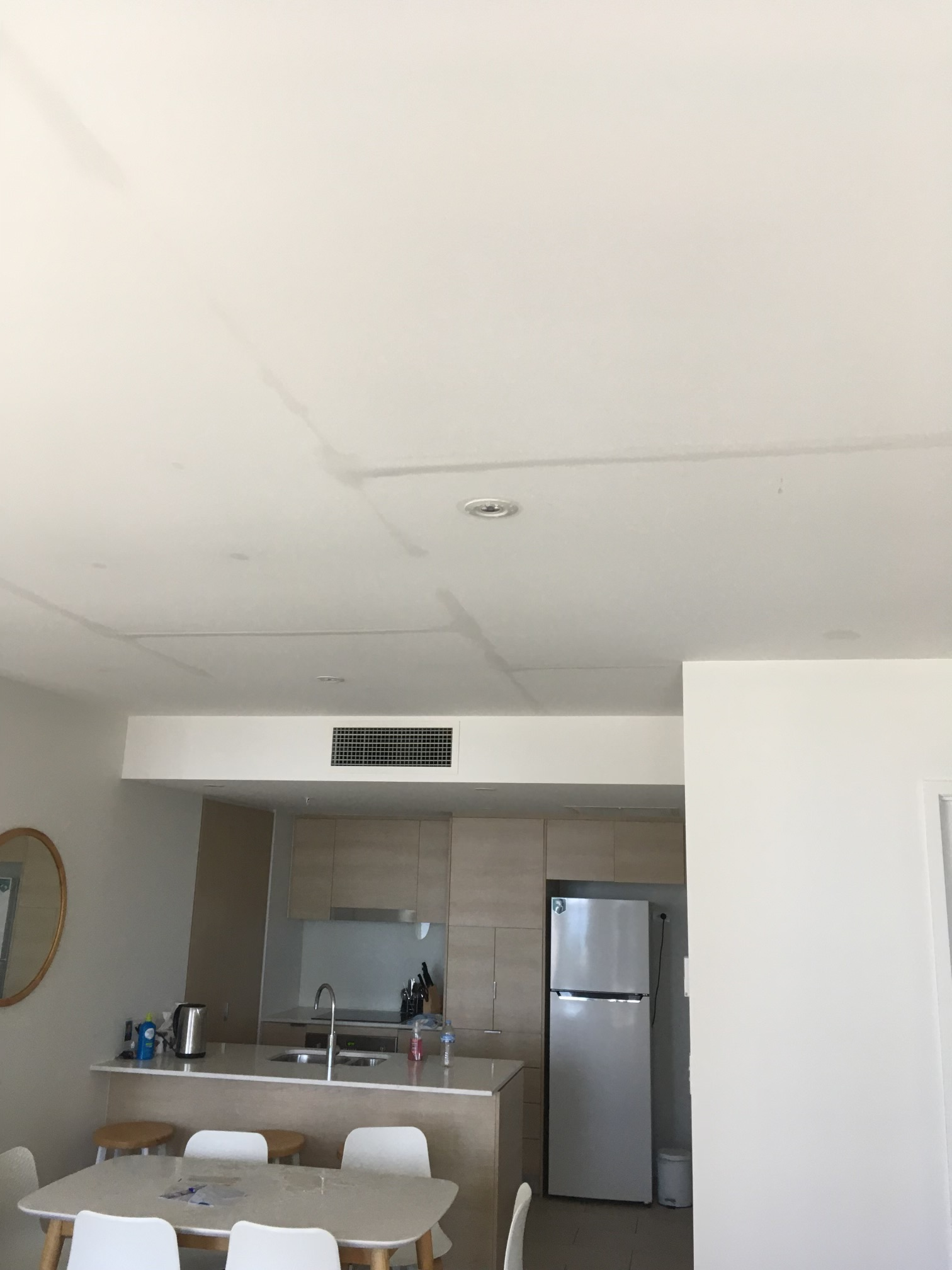 lines on the ceiling show water leaking from the apartment above