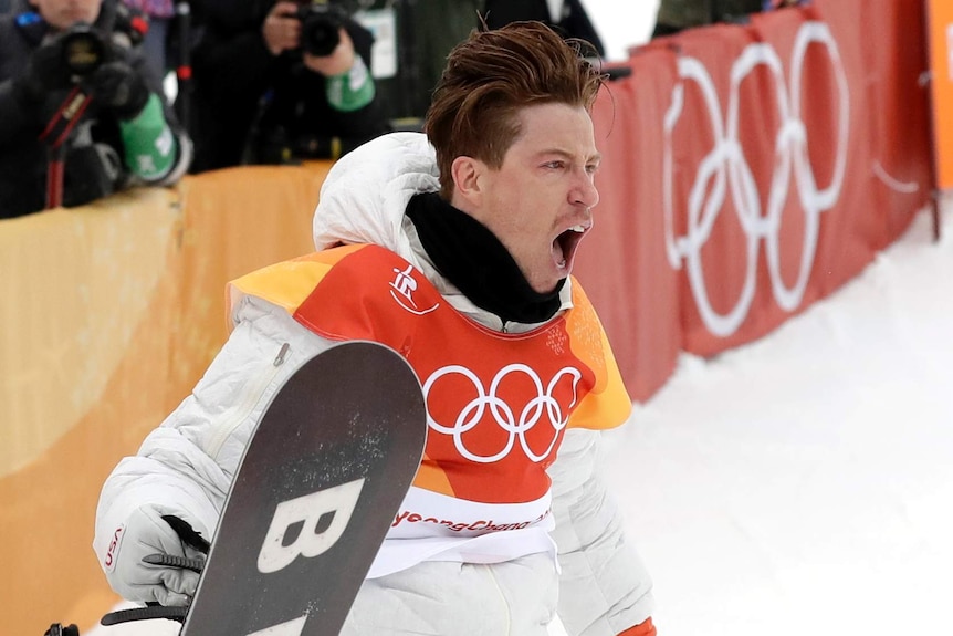 Shaun White screams out after winning the men's snowboard halfpipe final.