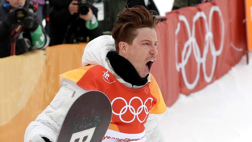Shaun White screams out after winning the men's snowboard halfpipe final.