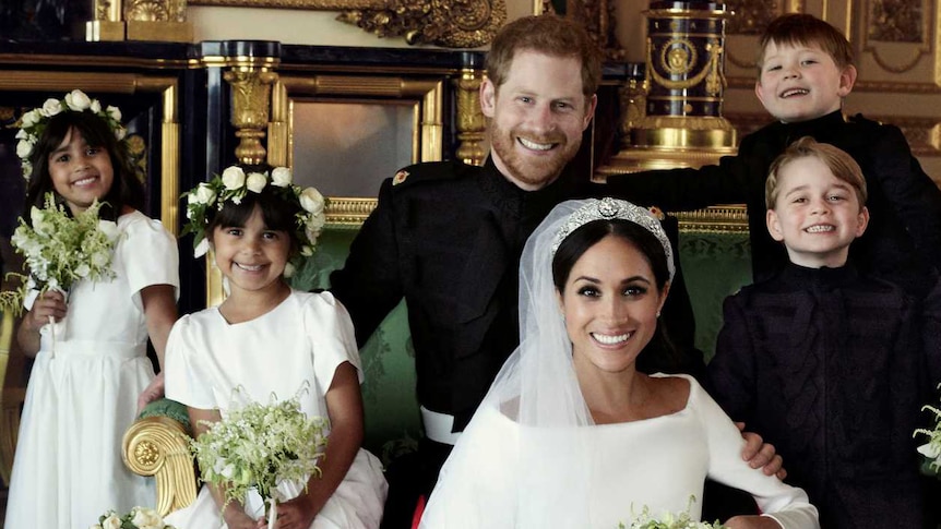 Meghan Markle and Prince Harry pose for an official photograph with flower girls and page boys