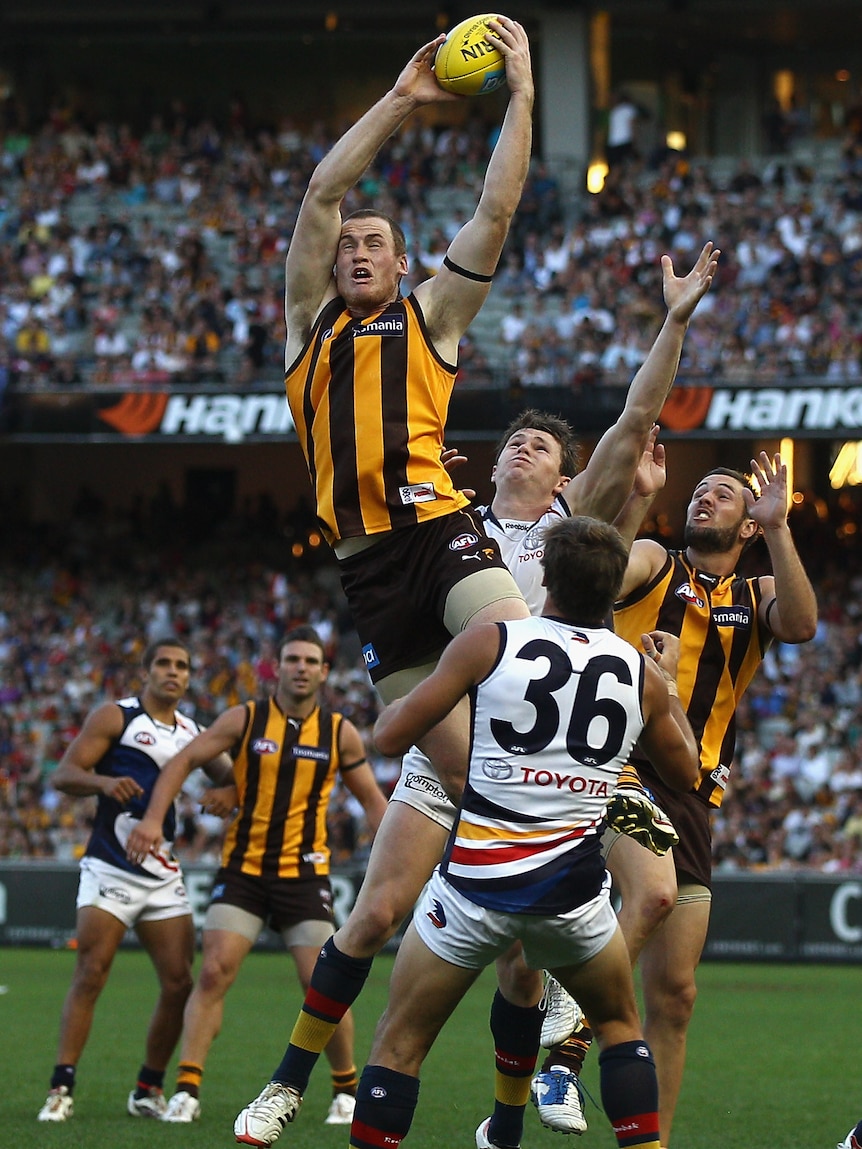 Aerial battle ... Jarryd Roughead soars over the pack for a mark at the MCG.