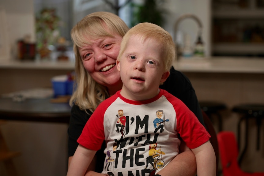 Cassandra Dinkelman holds her son George, who has Down syndrome