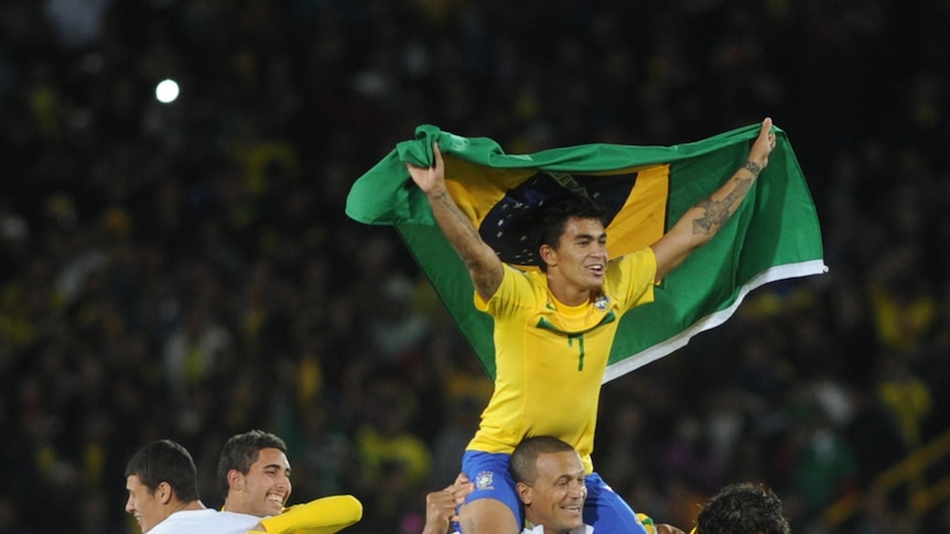 Extra-time triumph ... Brazilian midfielder Dudu (R, top) celebrates with his team-mates.