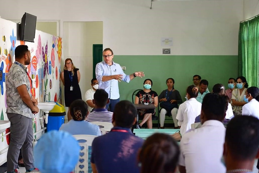 Dr Joshua Francis from the Menzies School of Health Research speaks to a crowd of health workers in Timor-Leste.