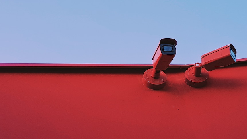Red surveillance cameras.