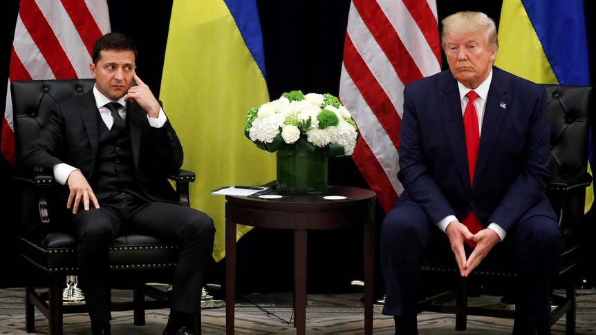 Ukraine's President Volodymyr Zelenskiy sitting with President Donald Trump.