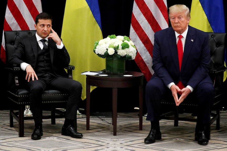 Ukraine's President Volodymyr Zelenskiy sitting with President Donald Trump.