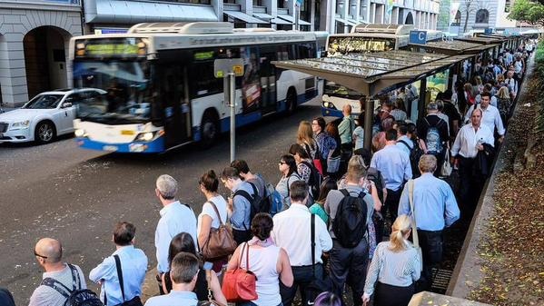 People lining up for buses in the CBD