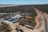 Drone shot of trucks parked up at a roadhouse