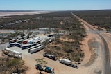 Drone shot of trucks parked up at a roadhouse