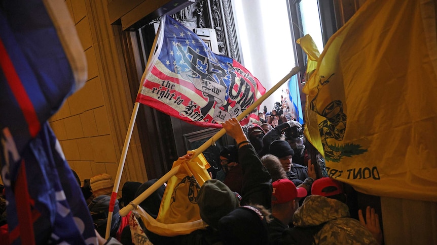 Protesters supporting US President Donald Trump break into the US Capitol