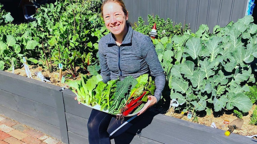 Rebecca Purvis with her vegetable garden in Melbourne’s west.