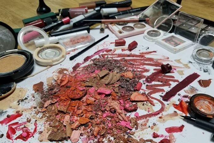 Screenshot of an Instagram post showing beauty products being destroyed.