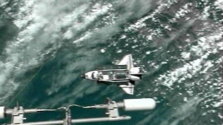 Discovery approaches the ISS for docking