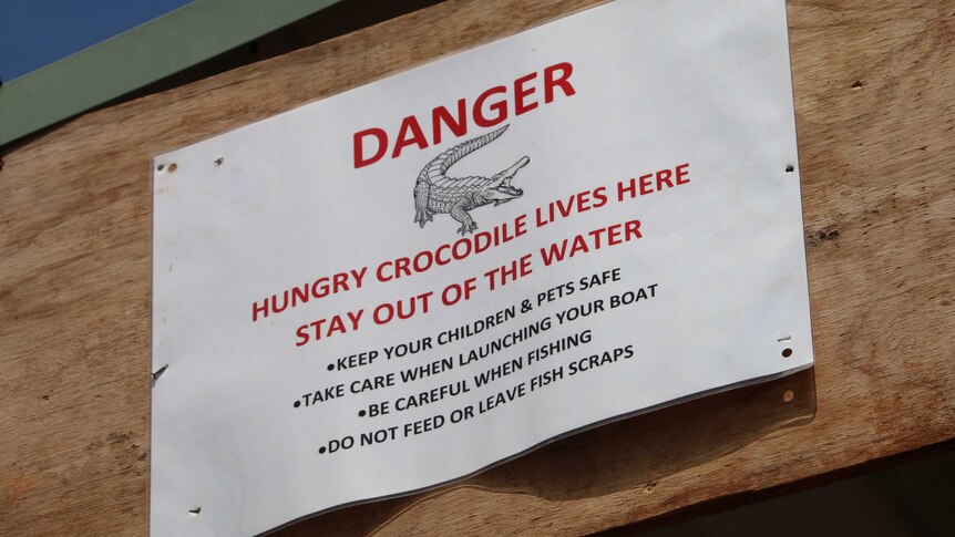 A crocodile warning sign at the barge landing area at Wadeye, in south west NT.