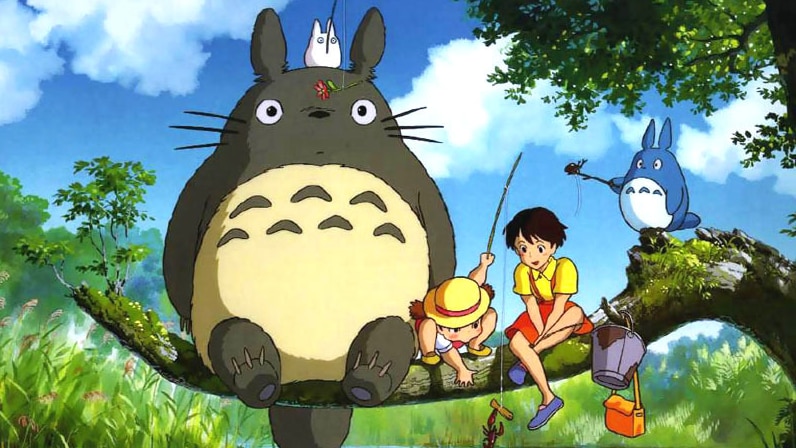 Totoro sits on a branch above a stream fishing with other characters