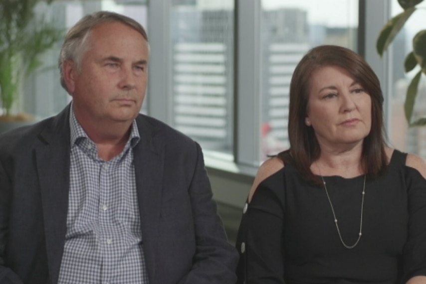 Ralph and Kathy Kelly sit in a city office