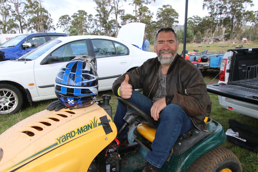 Peter Chitty on his lawn mower.