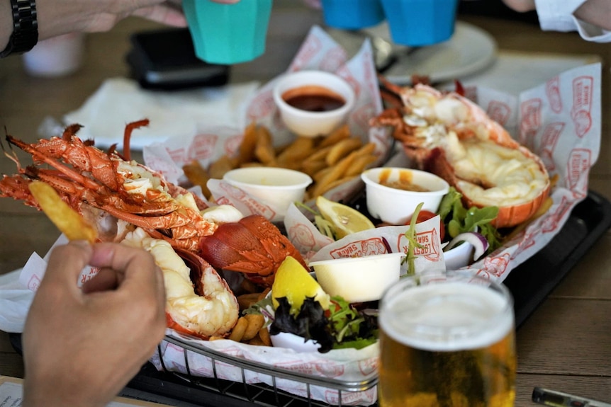 Lobster and chips in a basket.