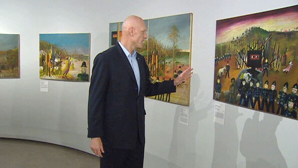 Federal Arts Minister Peter Garrett inspects the new Ned Kelly gallery.