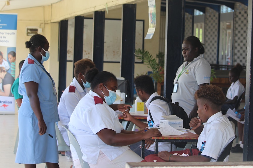 Health workers administered a vaccine to students at a school in Honiara.