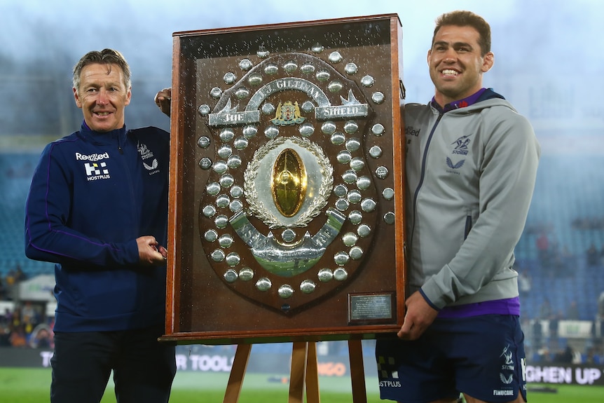 The Melbourne Storm NRL coach and captain hold the JJ Giltinan Shield.