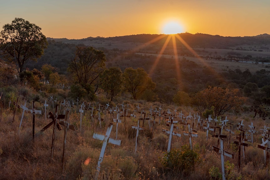 Crosses on a hillside have memorialised farmers killed in raids. Seventy-five were added last year.