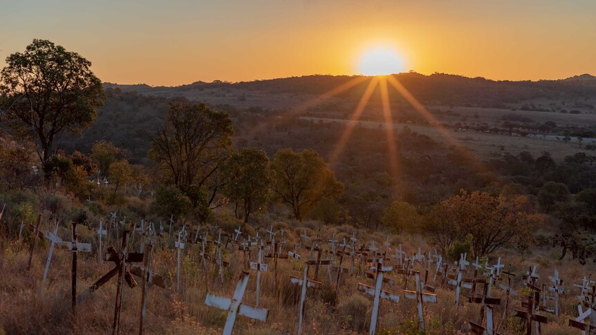 Crosses on a hillside have memorialised farmers killed in raids. Seventy-five were added last year.