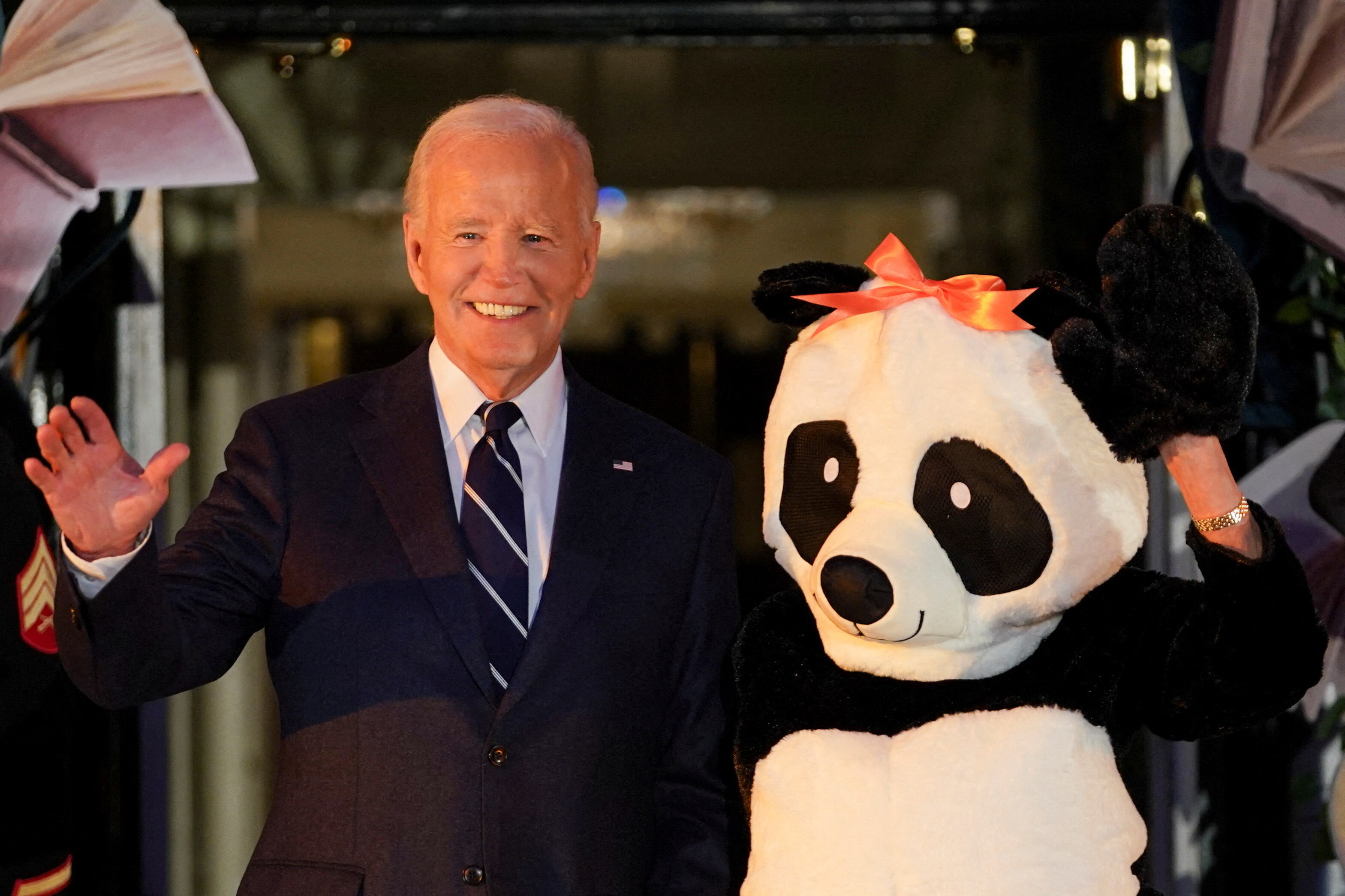 Joe Biden and someone in a panda costume. 