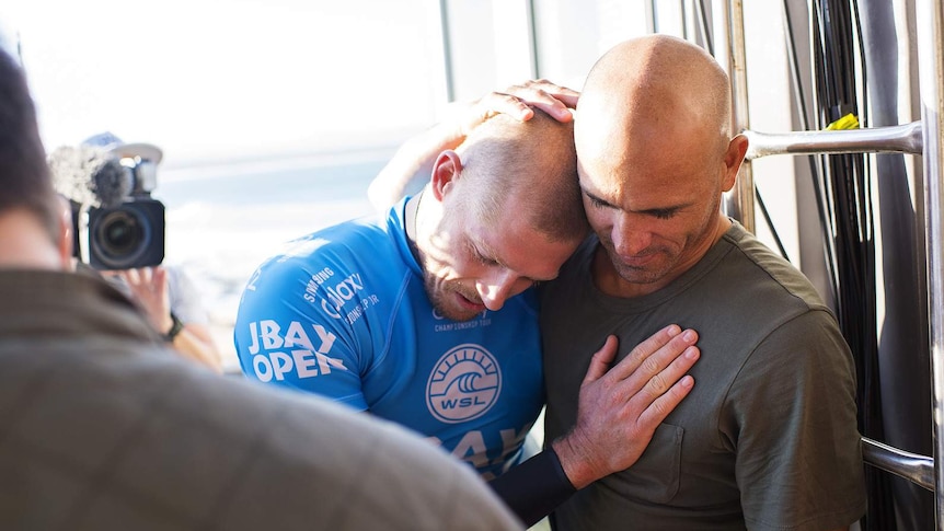 Mick Fanning embraced by Kelly Slater after shark attack