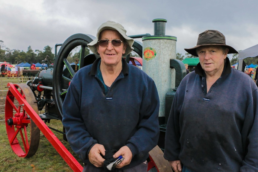 Brothers Eric and Murray Wythe stand in front of one their restored motors