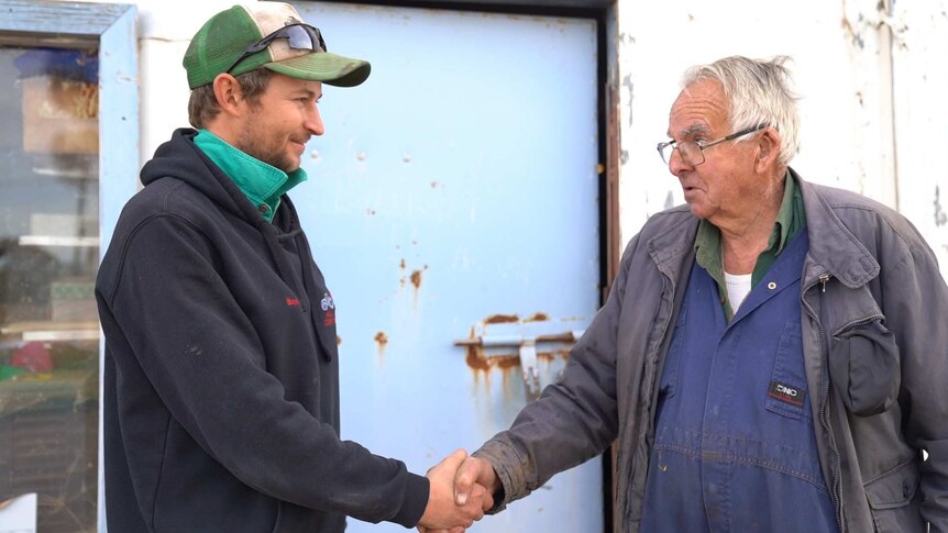 Mechanic Maurice Henry passes keys of his business to Justin Boyd