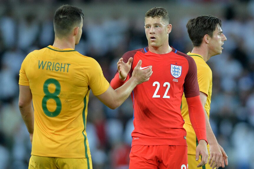 Bailey Wright shakes hands with Ross Barkley