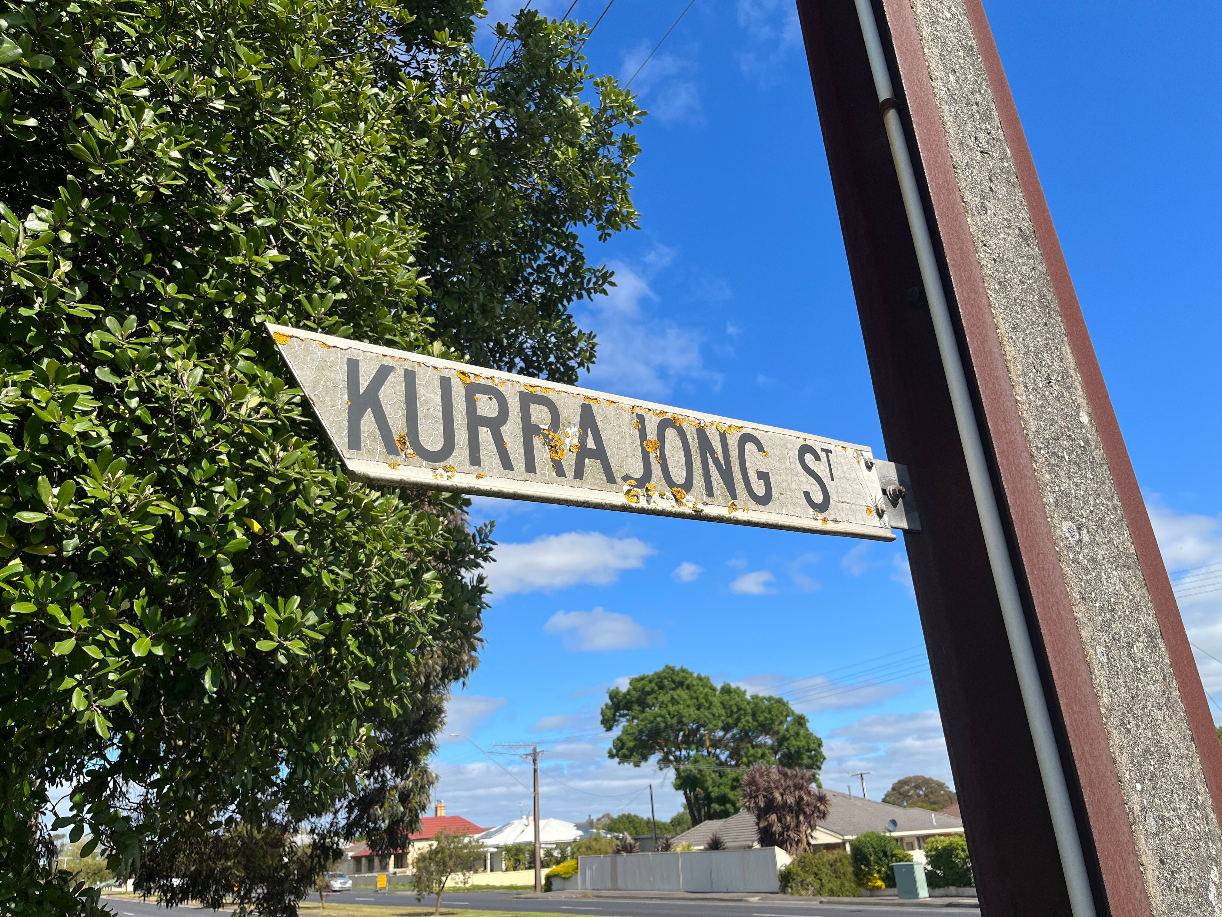 A road sign which reads Kurrajong Street.