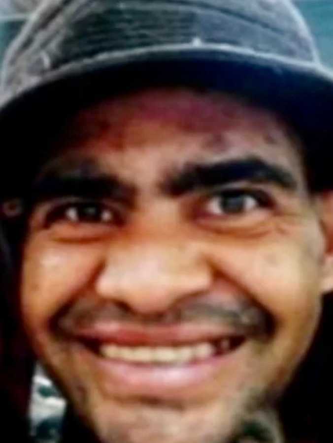 A smiling Indigenous man wearing a hat.