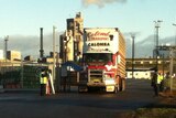 Truck leaves Port Adelaide dock loaded with sheep