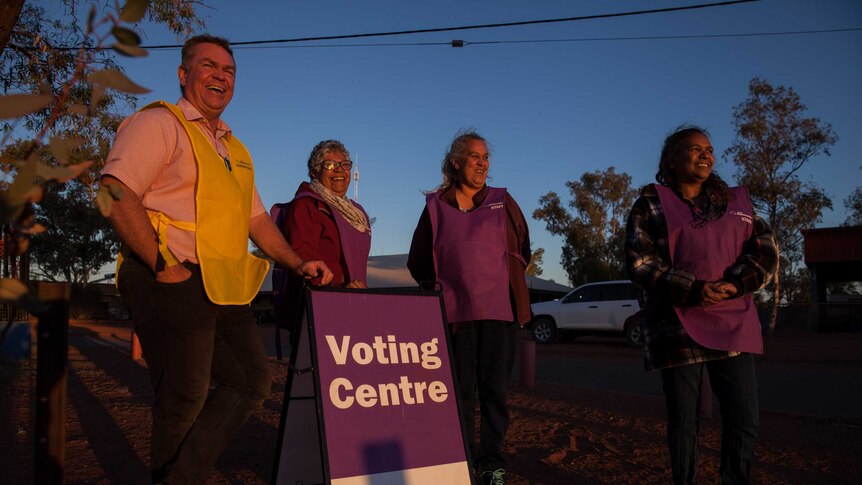 The AEC's all-Aboriginal remote polling team stand outside a polling place in Warburton, WA.