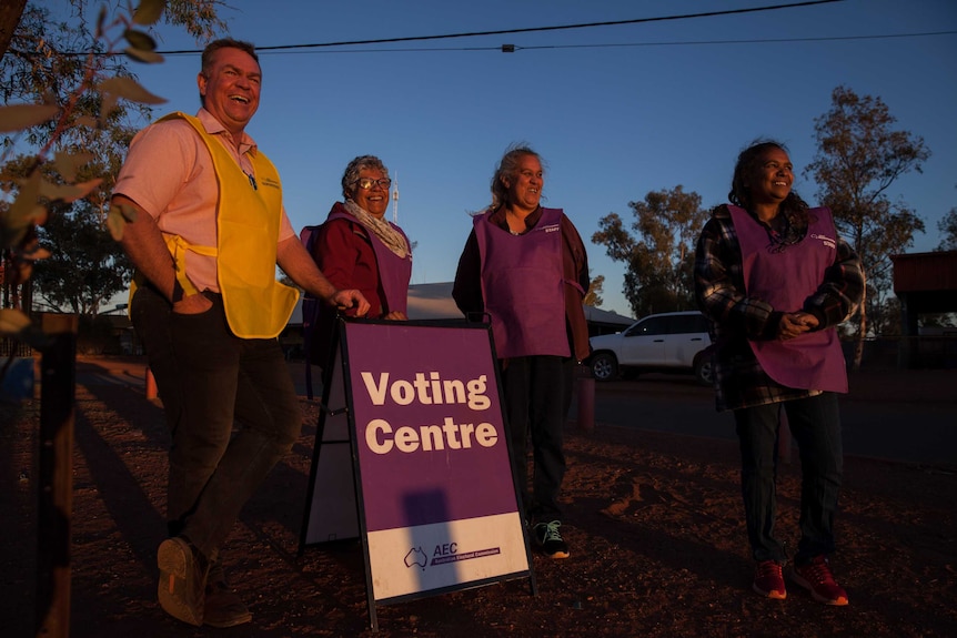 The AEC's all-Aboriginal remote polling team stand outside a polling place in Warburton, WA.