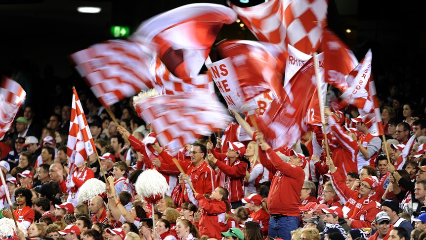 Sydney fans celebrate another goal in the Swans win over the Blues.