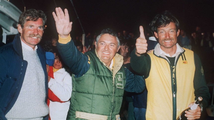 Historic win ... John Bertrand (R) and Alan Bond (C) celebrate Australia II's triumph in 1983