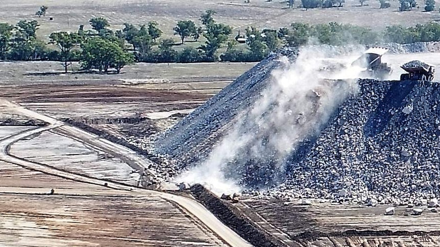 A photo of dust rising from the Maules Creek mining site.