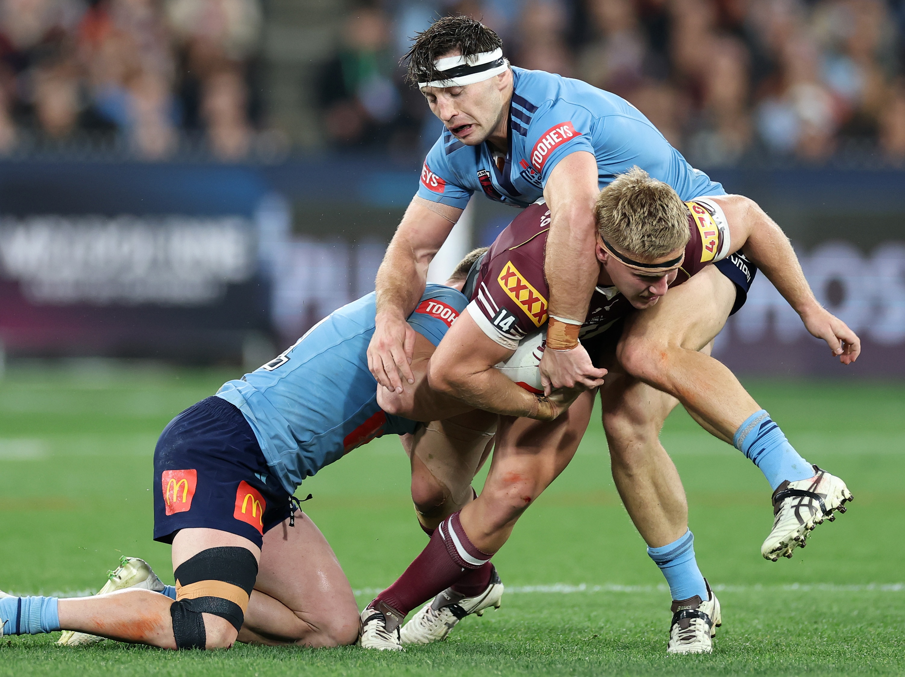 Max Plath runs the ball during an Origin match.