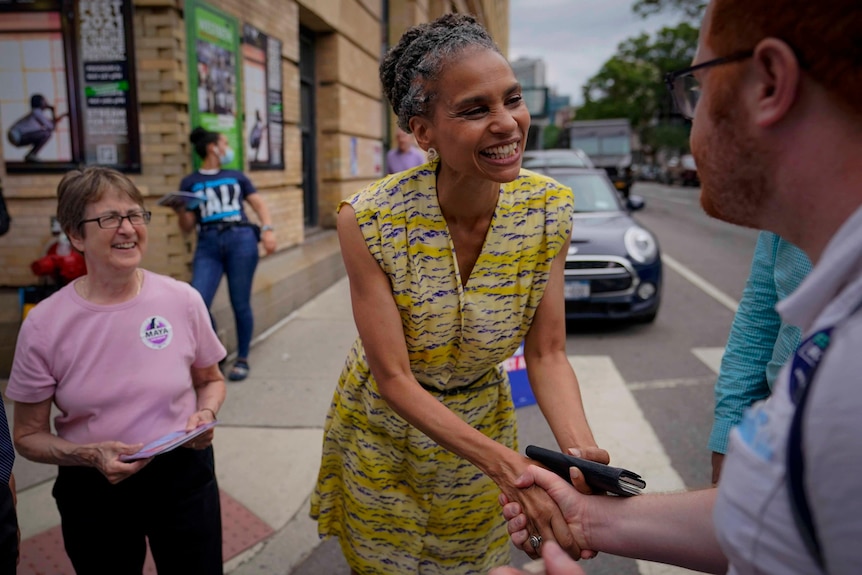 Democratic mayoral candidate Maya Wiley, center, as she greet voters during a campaign stop 