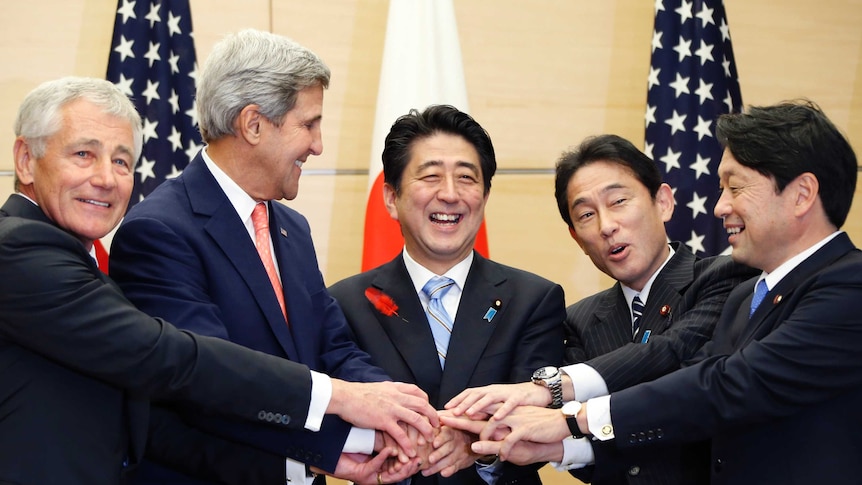 US Defence Secretary Chuck Hagel (L), US Secretary of State John Kerry (2nd L), Japan's Prime Minister Shinzo Abe (C), Japan's Foreign Minister Fumio Kishida (2nd R), and Japan's Defense Minister Itsunori Onodera in Tokyo October 3, 2013.