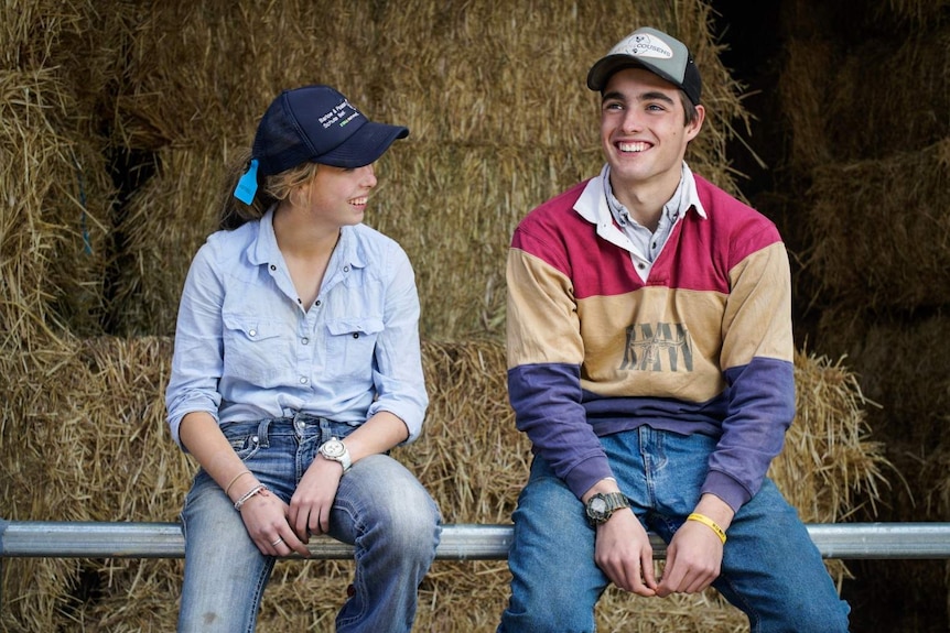 Siblings Walker and Caitlin Harrison are home to their family farm for the school holidays