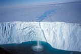 Melt stream falls over Antarctic ice shelf