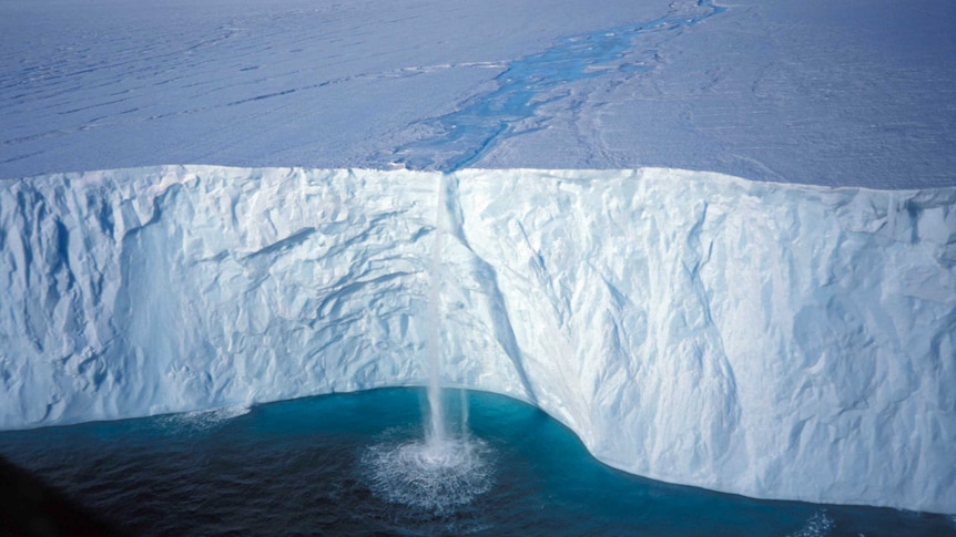 Melt stream falls over Antarctic ice shelf