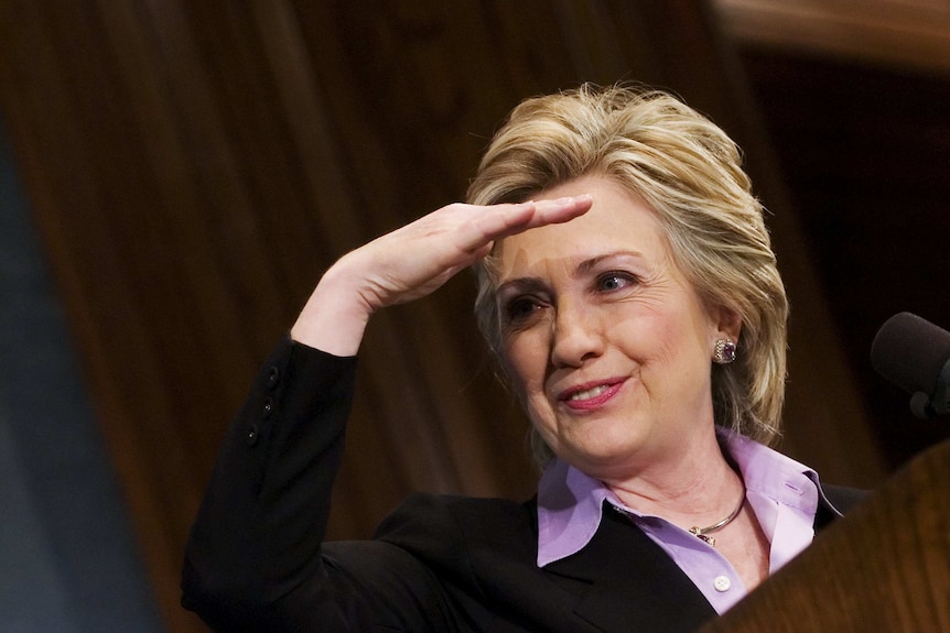 US senator Hillary Clinton looks over at a group of students