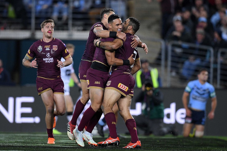 Valentine Holmes and the Maroons show their delight after opening the scoring in State of Origin II.