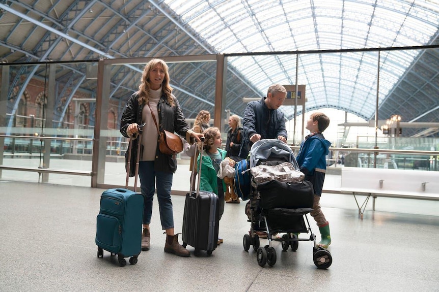 A family of four in an airport